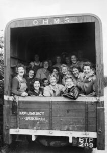 A group of happy Land Army girls in the back of an OHMS truck, Devon, England. Source: IWM D 21958