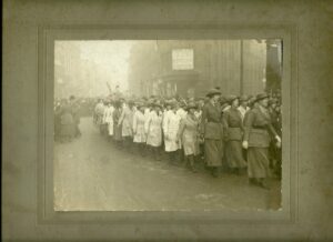 Elise's caption for the photo: “Woman’s (sic) Land Army 1917. Rally, at Birmingham, going to see the Whip. Me!!! 5th Land Girl on the left.”
