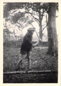 A Lumber Jill felling a tree.
