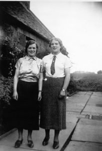 Agnes Mary Elkin in Land Girl uniform with sister Julia
